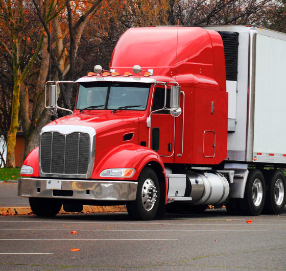 red truck running in a highway
