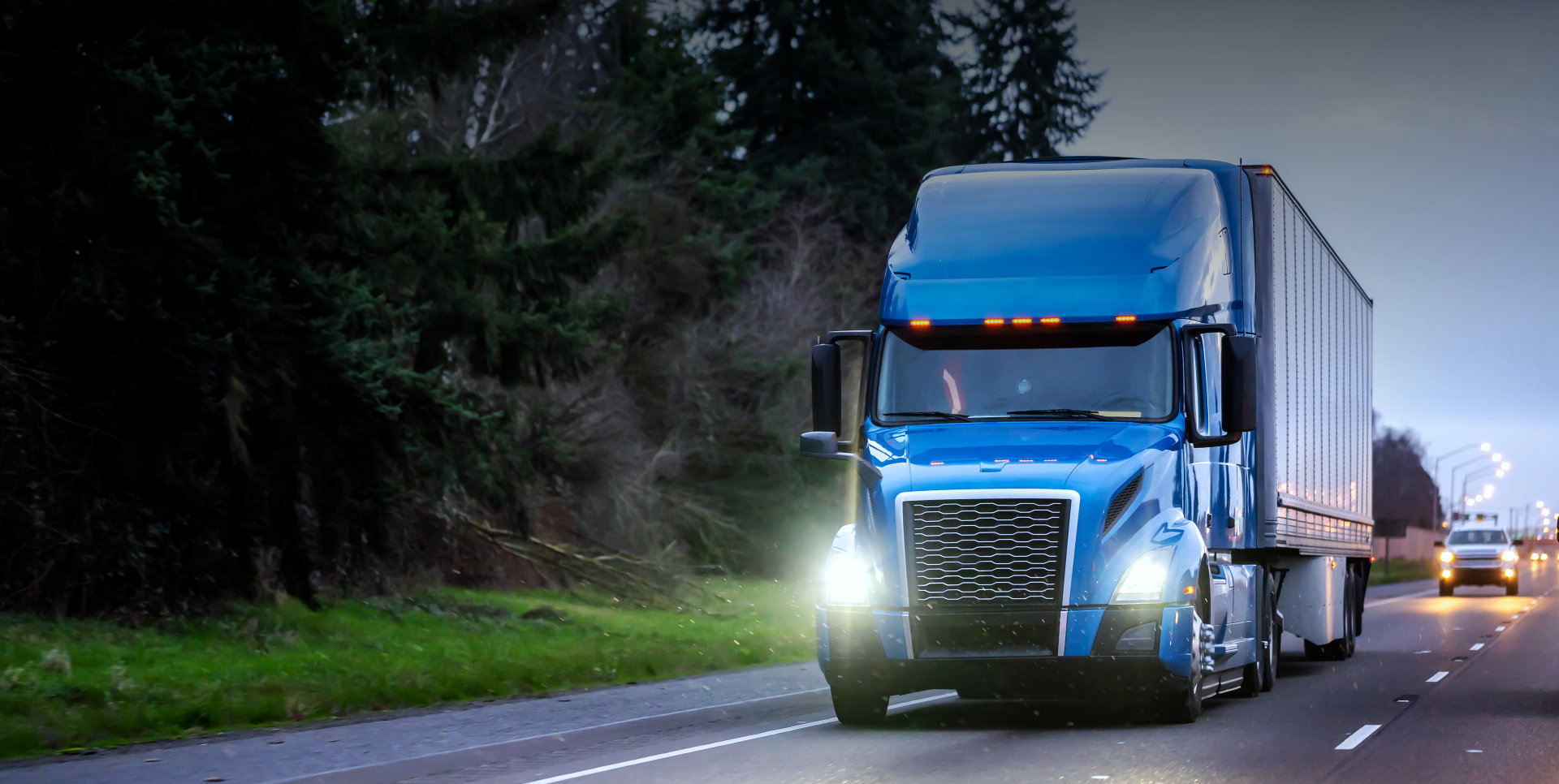 blue truck on a highway
